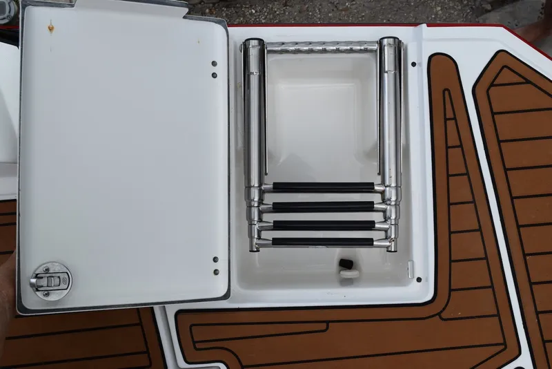 Slide: The Image of Foldable boat ladder on a 2018 Monterey M-45 deck, featuring teak-style flooring. - 21