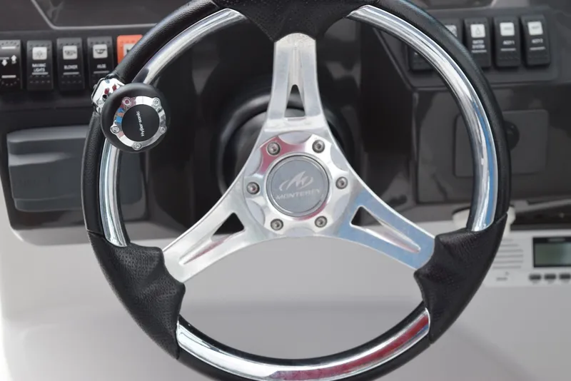 Slide: The Image of Steering wheel of 2018 Monterey M-45 boat with control panel in background. - 11