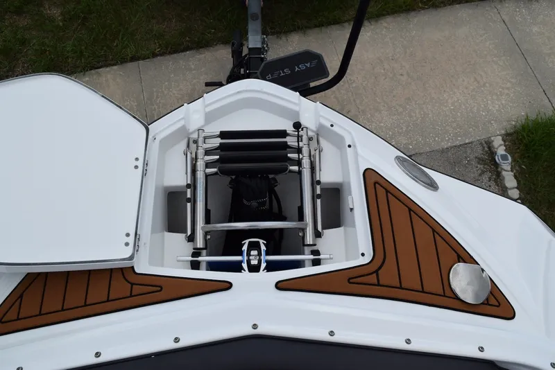 Slide: The Image of 2018 Monterey M-45 boat bow with open storage compartment and ladder. - 27