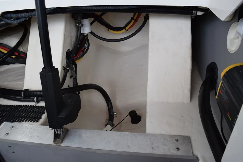 Slide: The Image of Engine compartment of a 2018 Monterey M-45 boat, showcasing wiring and components. - 32