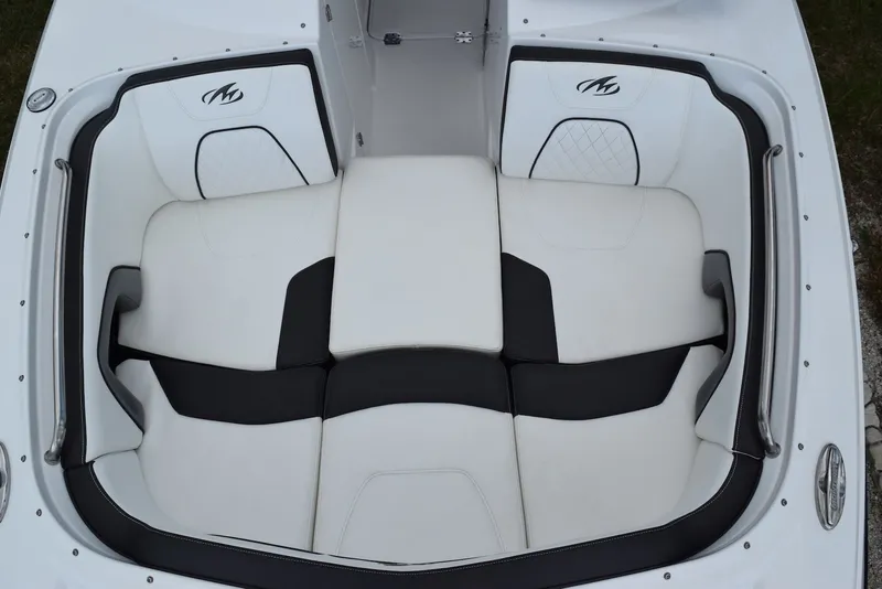 Slide: The Image of Luxurious seating on a 2018 Monterey M-45 boat, featuring white and black upholstery. - 19