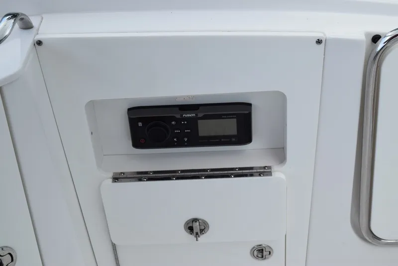 Slide: The Image of Control panel on a 2018 Monterey M-45 boat, featuring a Fusion audio system. - 23