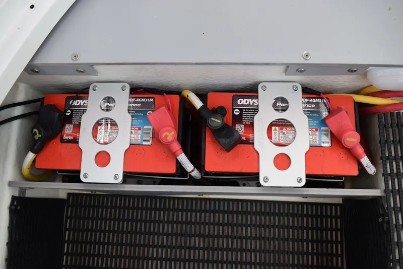 Slide: The Image of Dual Odyssey batteries in a 2018 Monterey M-45 boat, secured with metal brackets. - 34