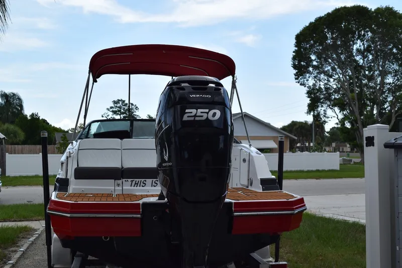Slide: The Image of 2018 Monterey M-45 boat with a 250 Verado engine, parked in a residential area. - 3