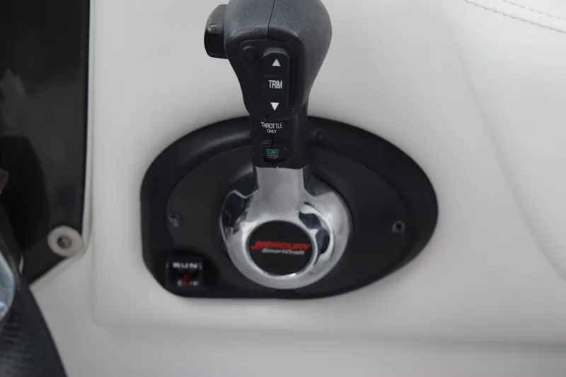 Slide: The Image of Throttle control lever on a 2018 Monterey M-45 boat dashboard. - 14