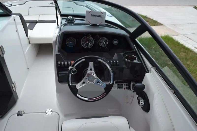 Slide: The Image of Cockpit of 2018 Monterey M-45 boat with steering wheel and Simrad navigation system. - 10