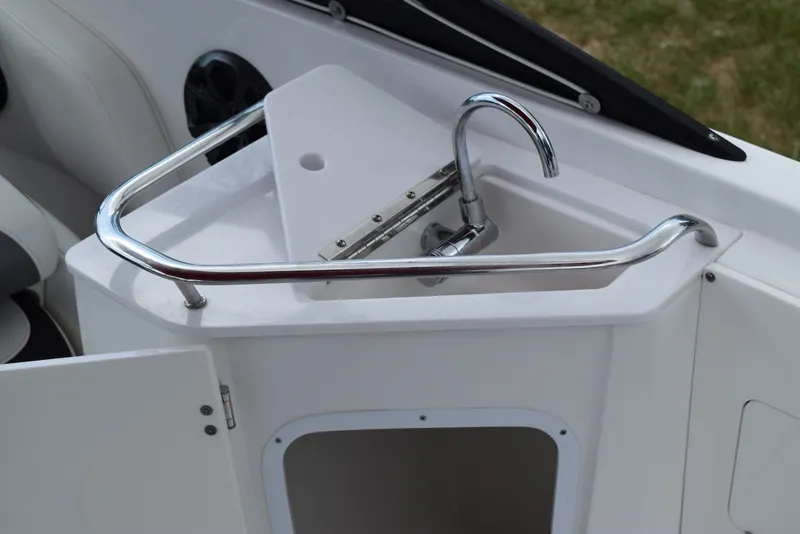 Slide: The Image of 2018 Monterey M-45 boat interior with sink and chrome rail. - 26