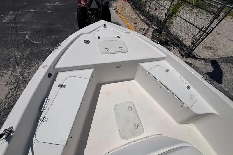 Slide: The Image of Century 1900 Inshore 2001 boat interior with storage compartments and clean deck. - 22