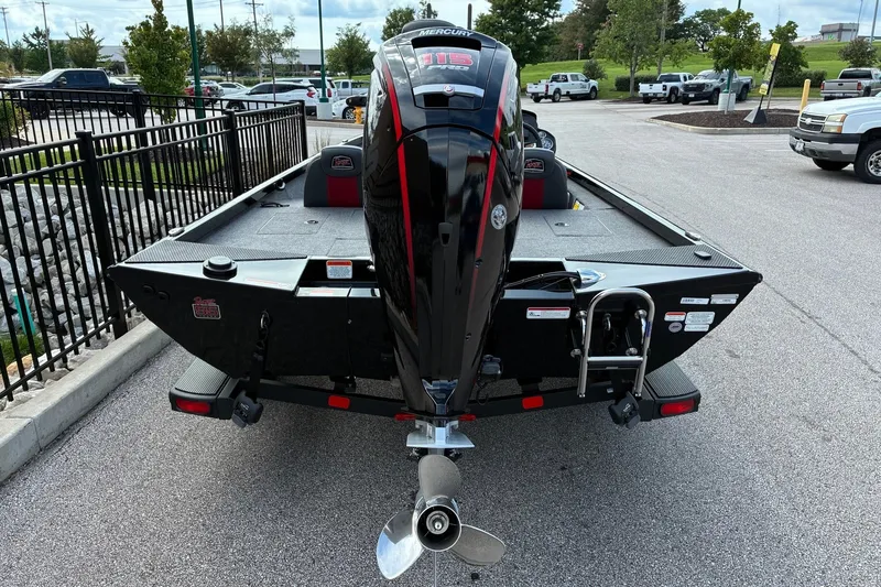 Slide: The Image of 2023 Ranger RT188 boat with Mercury engine, parked in a lot, rear view. - 2