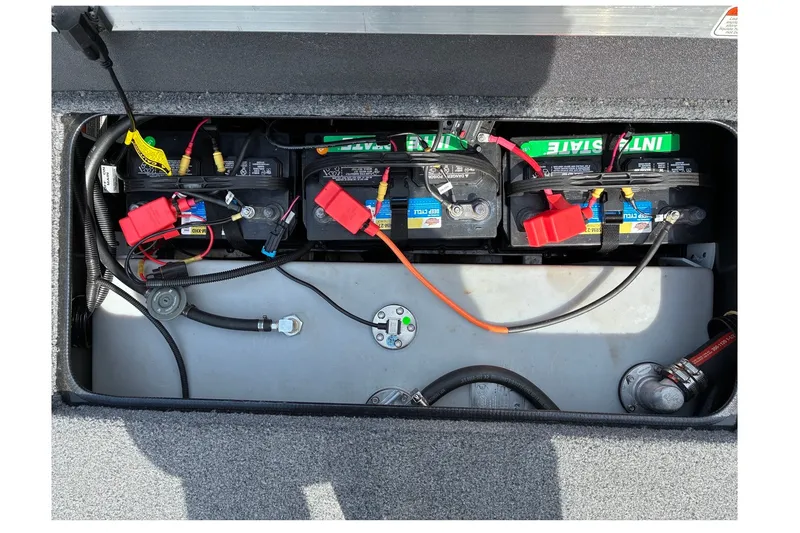 Slide: The Image of 2023 Ranger RT188 boat battery compartment with wiring and connections. - 18