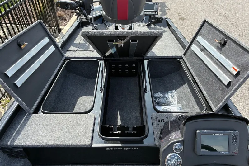 Slide: The Image of 2023 Ranger RT188 boat interior with open storage compartments and control panel. - 15