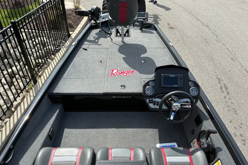 Slide: The Image of 2023 Ranger RT188 boat interior with steering console and seating, featuring modern navigation equipment. - 12