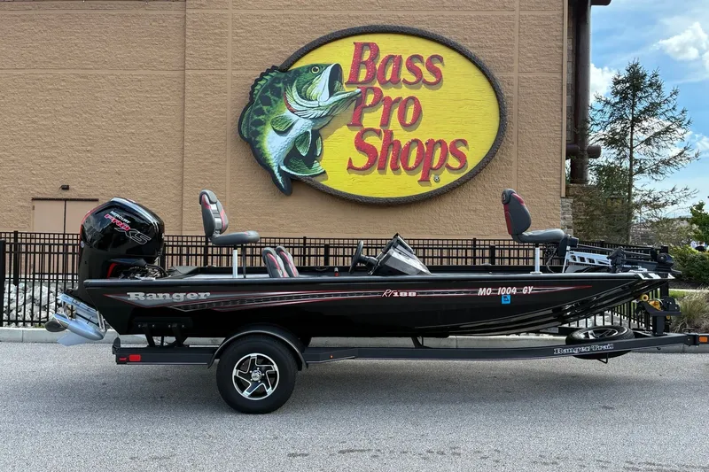 The Image of 2023 Ranger RT188 boat parked outside Bass Pro Shops store. - 0