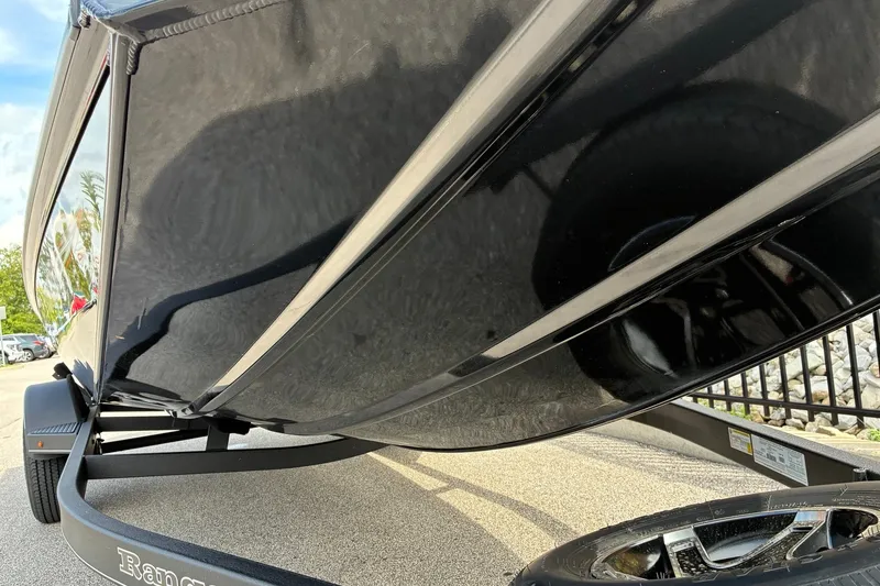 Slide: The Image of 2023 Ranger RT188 boat hull and trailer, close-up view. - 8