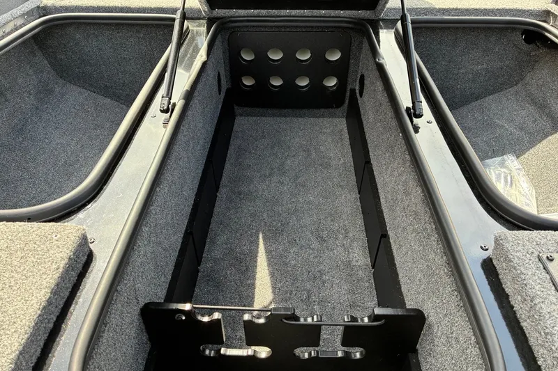 Slide: The Image of 2023 Ranger RT188 boat storage compartment with carpeted interior and organized layout. - 16