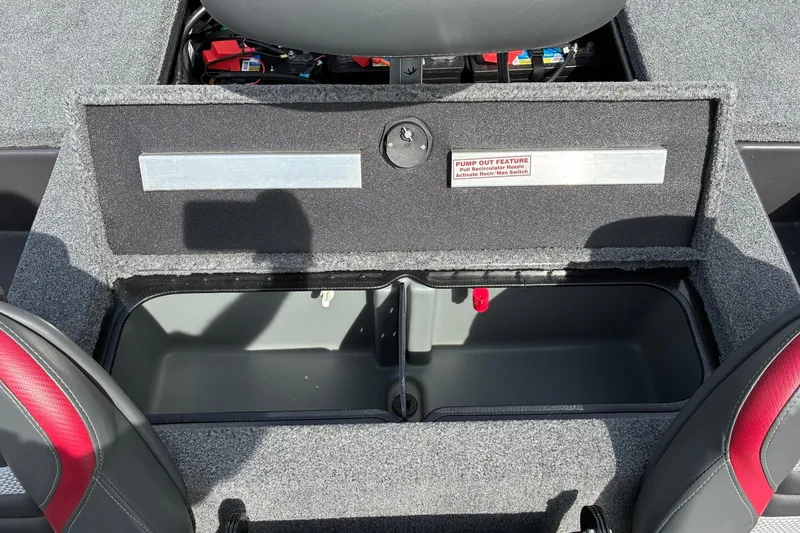 Slide: The Image of 2023 Ranger RT188 boat storage compartment with pump-out feature and red-accented seats. - 17