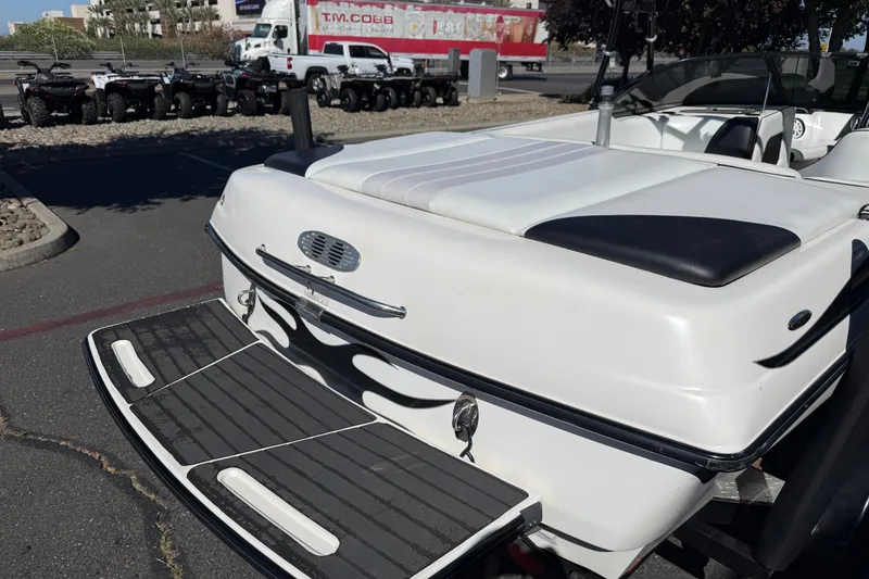 Slide: The Image of 2004 MB B-52 boat with swim platform in parking lot. - 12