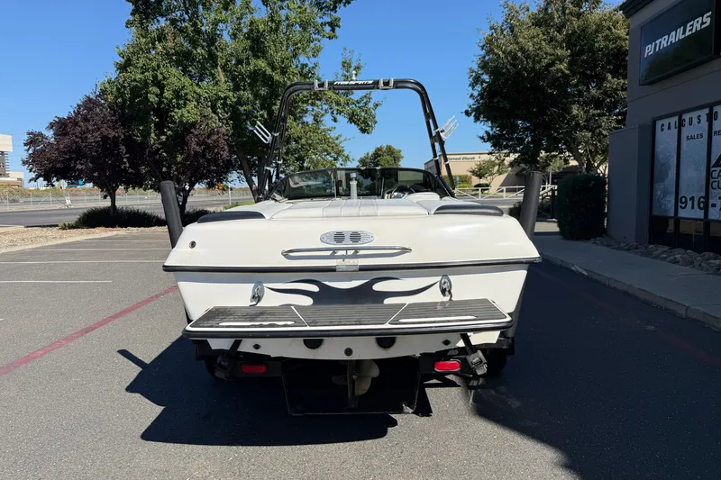 Slide: The Image of Rear view of a 2004 MB B-52 boat parked outdoors. - 4