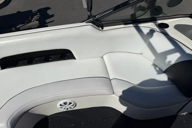Slide: The Image of Interior seating of a 2004 MB B-52 boat with white upholstery. - 18
