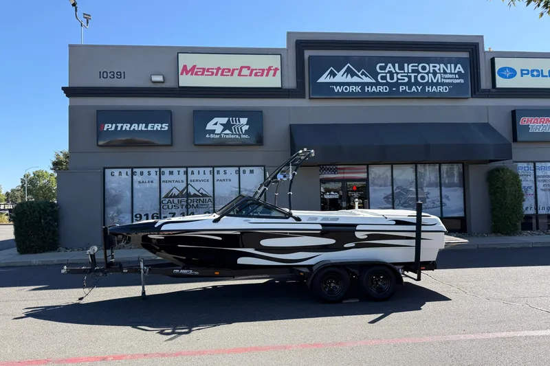 Slide: The Image of 2004 MB B-52 boat with custom graphics parked outside California Custom Trailers shop. - 2