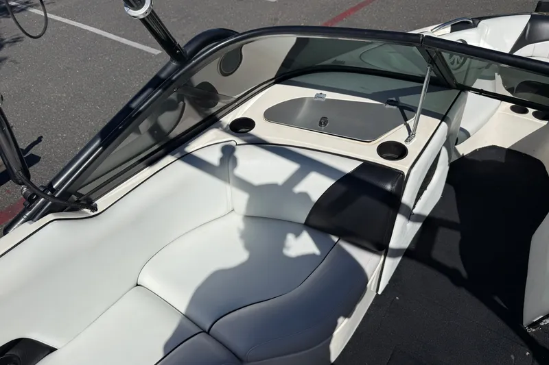 Slide: The Image of 2004 MB B-52 boat interior with white seating and black accents. - 19