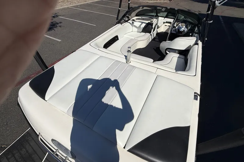 Slide: The Image of 2004 MB B-52 boat interior with white seating and shadow on deck. - 13