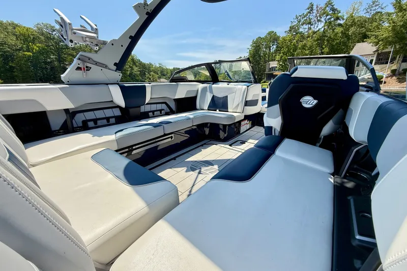 Slide: The Image of 2022 Malibu Wakesetter 23 MXZ interior with luxurious seating and modern design. - 10
