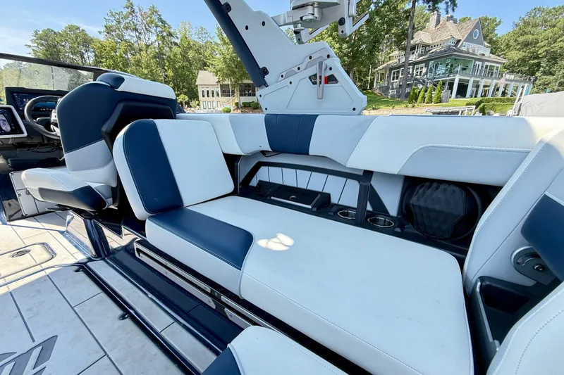 Slide: The Image of 2022 Malibu Wakesetter 23 MXZ interior with luxurious seating and modern design. - 25