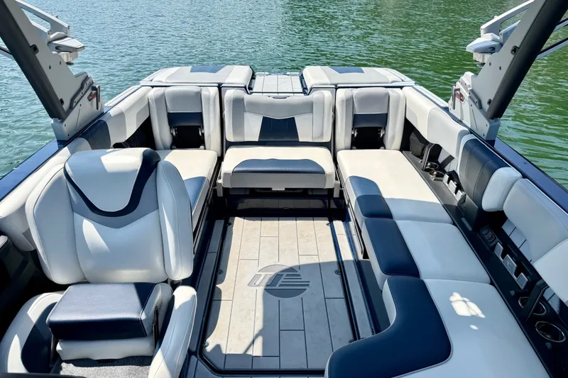 Slide: The Image of Interior of 2022 Malibu Wakesetter 23 MXZ boat with luxurious seating on a lake. - 21