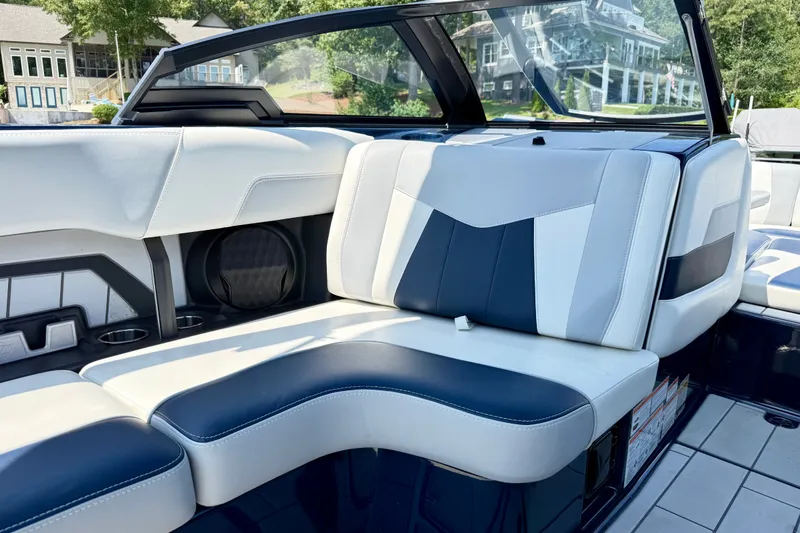 Slide: The Image of Interior of 2022 Malibu Wakesetter 23 MXZ boat with stylish seating and cup holders. - 19