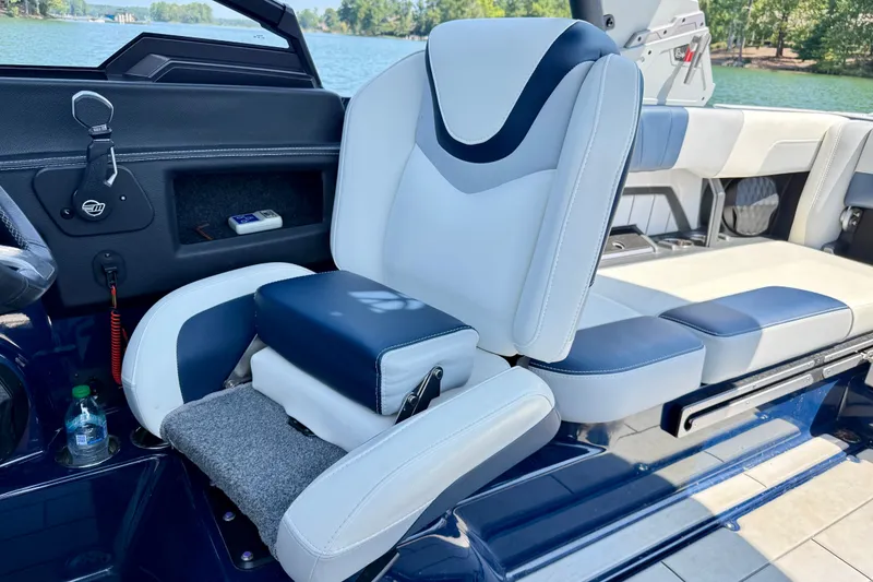 Slide: The Image of 2022 Malibu Wakesetter 23 MXZ interior with luxurious seating and lake view. - 13