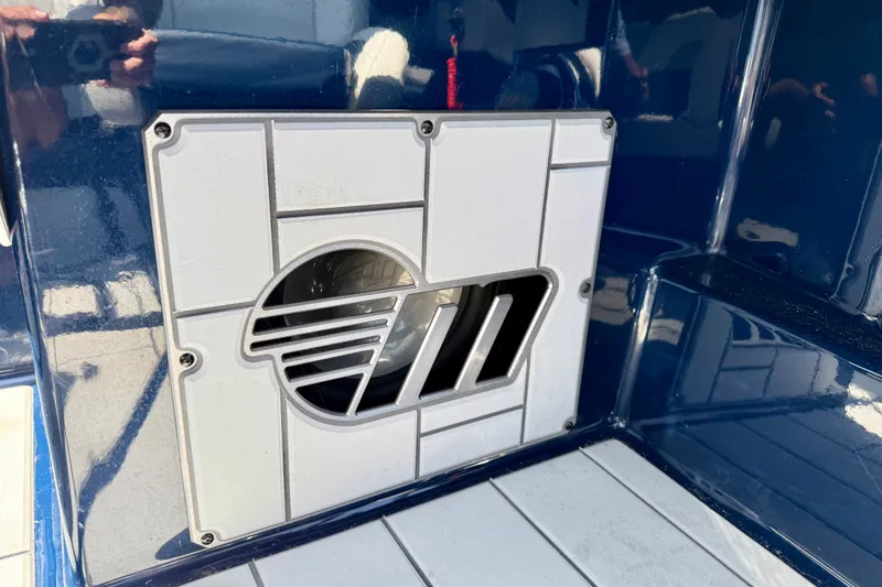 Slide: The Image of 2022 Malibu Wakesetter 23 MXZ boat detail with sleek design and logo. - 31