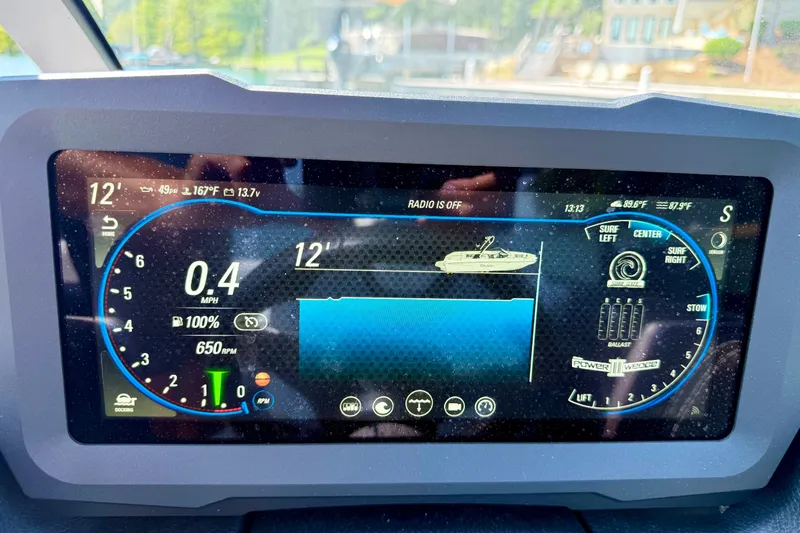 Slide: The Image of Dashboard display of a 2022 Malibu Wakesetter 23 MXZ boat, showing speed and settings. - 16
