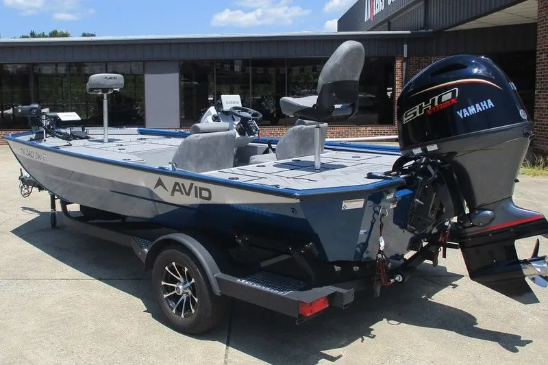 Slide: The Image of 2026 Avid 18 Vertex boat with Yamaha motor on trailer, parked outdoors. - 3