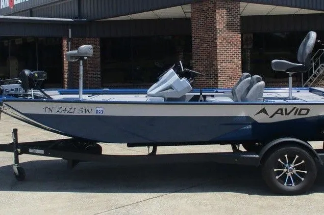 The Image of 2026 Avid 18 Vertex fishing boat on trailer, parked outdoors. - 1