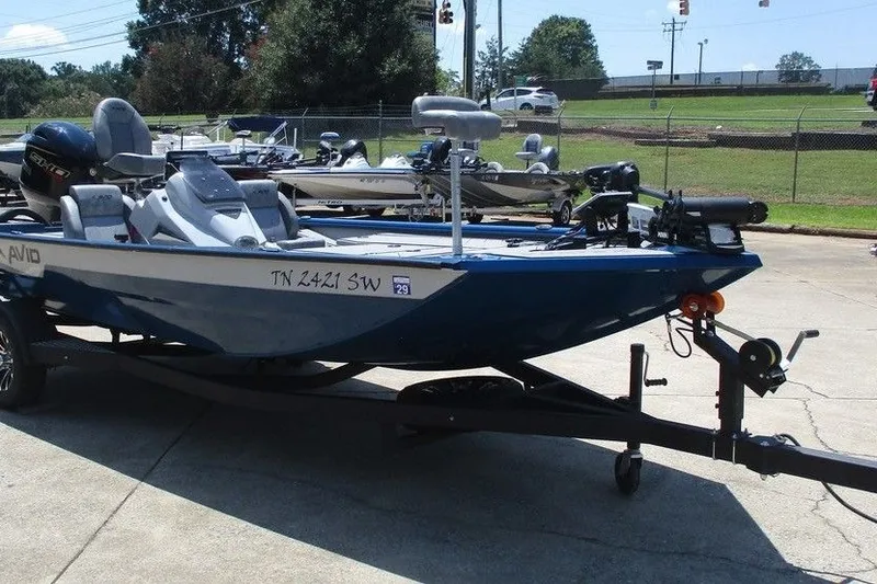 Slide: The Image of 2026 Avid 18 Vertex boat on trailer in outdoor setting. - 2