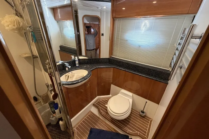Slide: The Image of Luxurious bathroom in 2001 Viking Sport Cruisers V65 yacht with modern fixtures. - 48