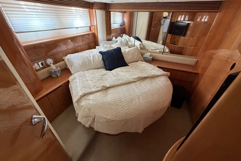 Slide: The Image of Luxurious bedroom interior of 2001 Viking Sport Cruisers V65 yacht with elegant wood finish. - 68