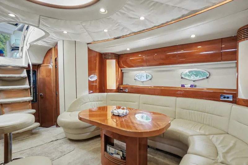 Slide: The Image of Luxurious interior of 2001 Viking Sport Cruisers V65 yacht with elegant seating and wooden finishes. - 38