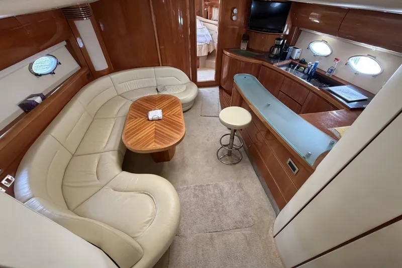 Slide: The Image of Luxurious interior of 2001 Viking Sport Cruisers V65 yacht with elegant seating and modern amenities. - 53