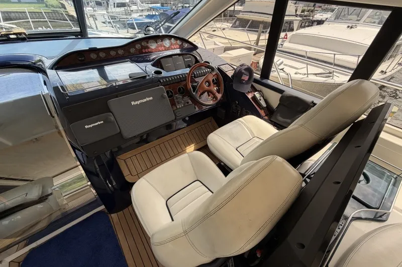 Slide: The Image of Interior cockpit of 2001 Viking Sport Cruisers V65 yacht with Raymarine navigation equipment. - 52
