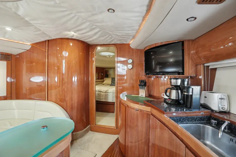Slide: The Image of Luxurious interior of 2001 Viking Sport Cruisers V65 yacht with modern amenities and wood finish. - 43