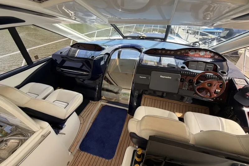Slide: The Image of Luxurious 2001 Viking Sport Cruisers V65 yacht interior with modern helm and plush seating. - 47