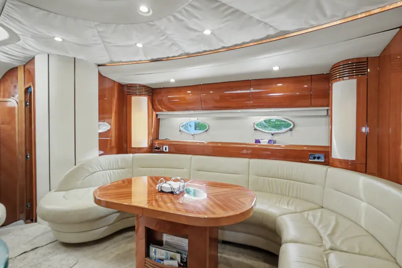 Slide: The Image of Luxurious interior of 2001 Viking Sport Cruisers V65 yacht with leather seating and wooden accents. - 39