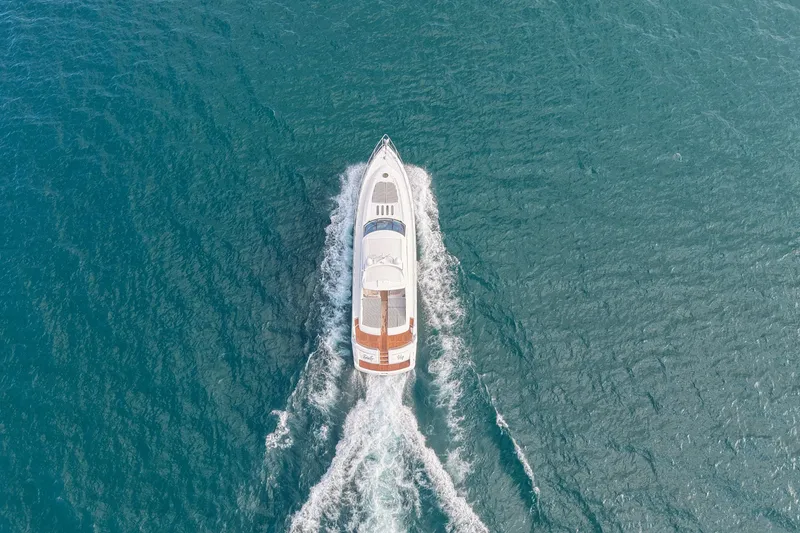 Slide: The Image of Aerial view of 2001 Viking Sport Cruisers V65 yacht cruising on open water. - 7