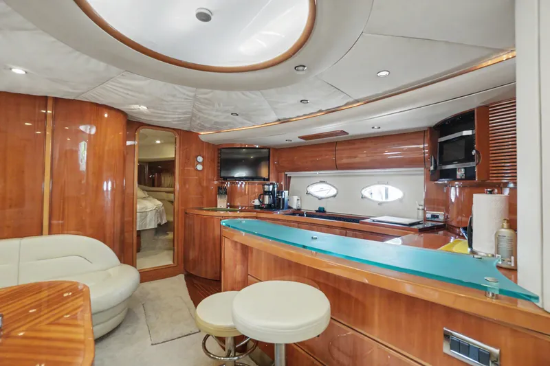 Slide: The Image of Luxurious interior of 2001 Viking Sport Cruisers V65 yacht with modern kitchen and seating area. - 41