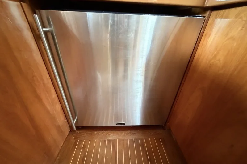 Slide: The Image of Stainless steel refrigerator in 2001 Viking Sport Cruisers V65 yacht interior. - 50