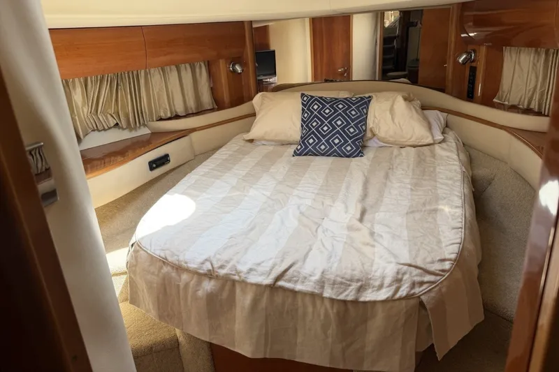Slide: The Image of Luxurious cabin interior of 2001 Viking Sport Cruisers V65 yacht with cozy bed. - 69
