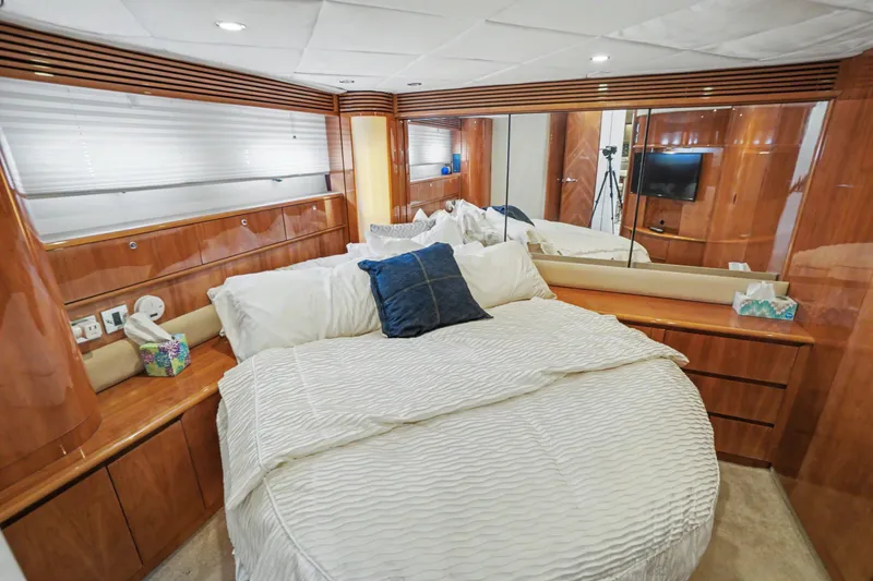 Slide: The Image of Luxurious bedroom interior of 2001 Viking Sport Cruisers V65 yacht with elegant wood finishes. - 33