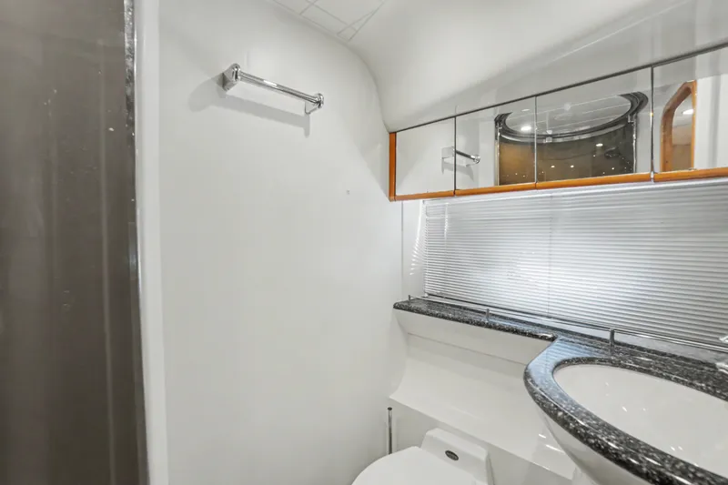 Slide: The Image of Luxurious bathroom in 2001 Viking Sport Cruisers V65 yacht with sleek design and modern fixtures. - 31